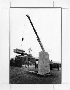 Because each piece of the "Portal" sculpture weighed several tons, cranes were needed to move the pieces into place and secure them during installation.